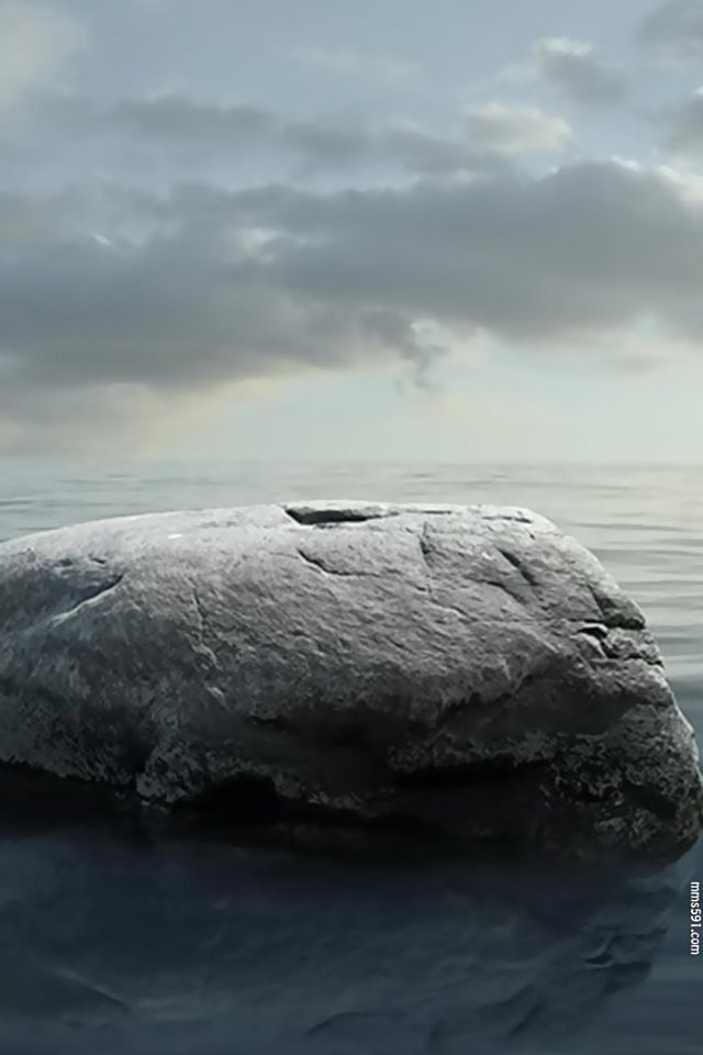还算平静的海中，一块静静的大石头手机壁纸图片